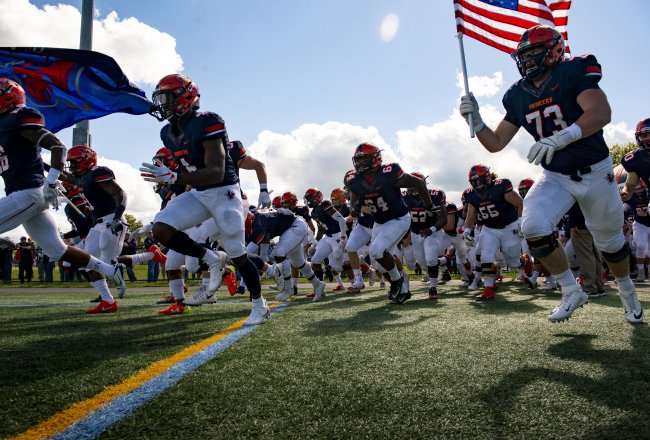Football players hit the field.
